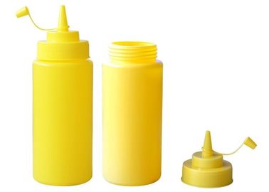 Бутылки соуса качества еды желтые пластичные с соусом покрывают, сжумают бутылку соуса